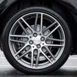Close up photograph of chrome vehicle wheel