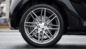 Close up photograph of chrome vehicle wheel