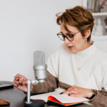 Woman narrating story while recording audiobook