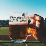 Man drinking beer during games
